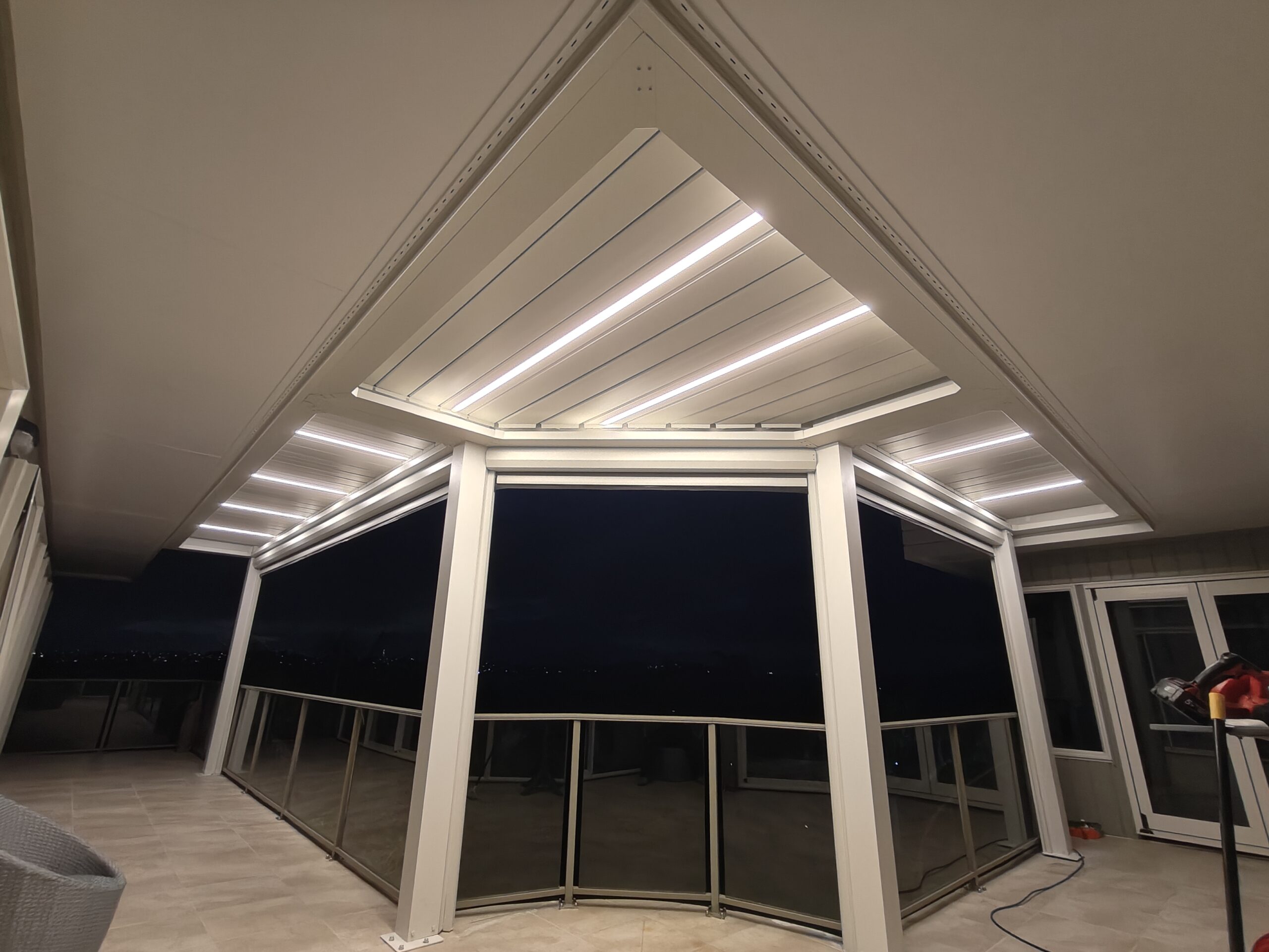 Custom Pergola with Retractable Blinds for a Seaside Home