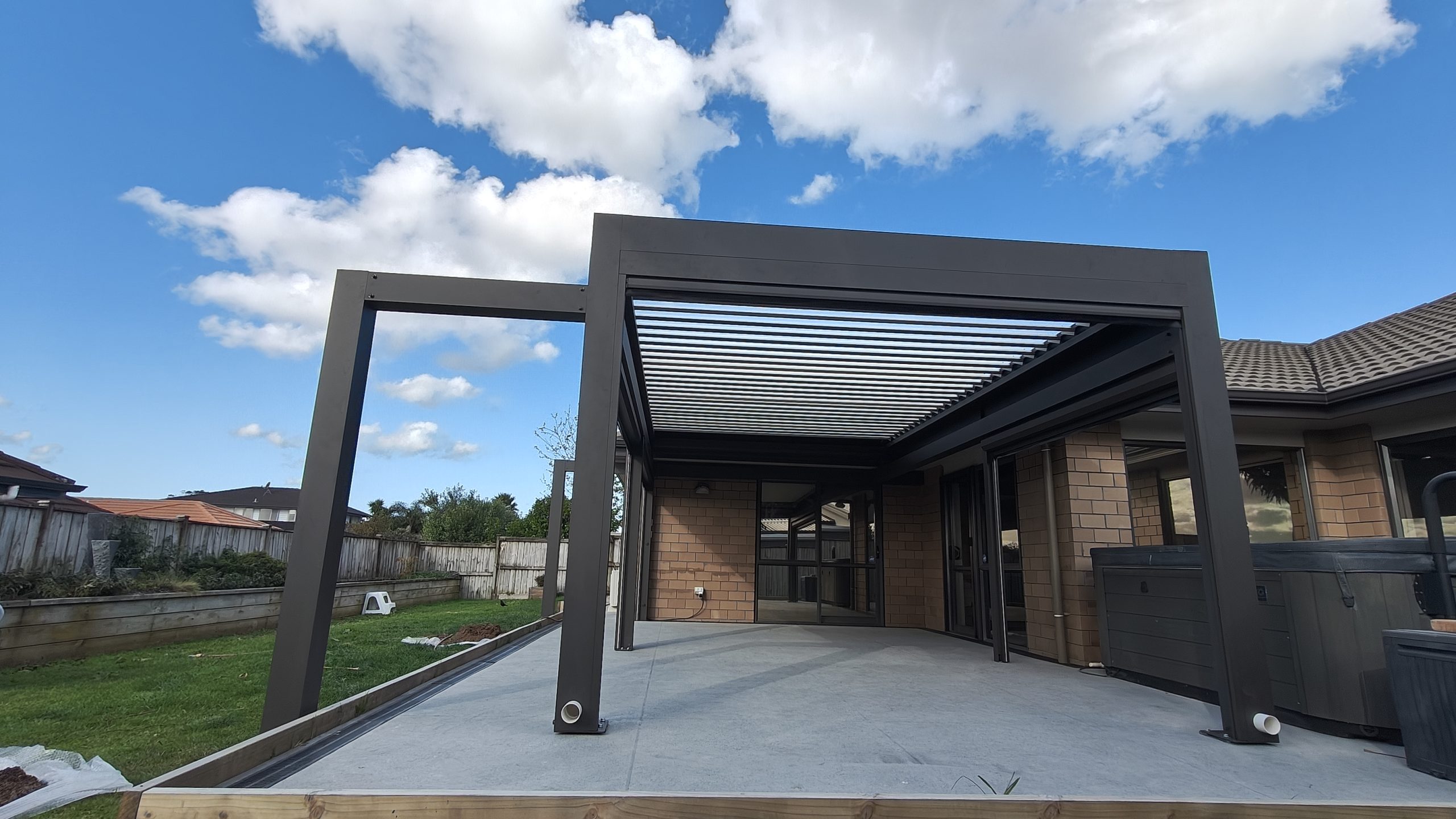 Dual Post Corner Pergola Integrated with Brick Home Eave