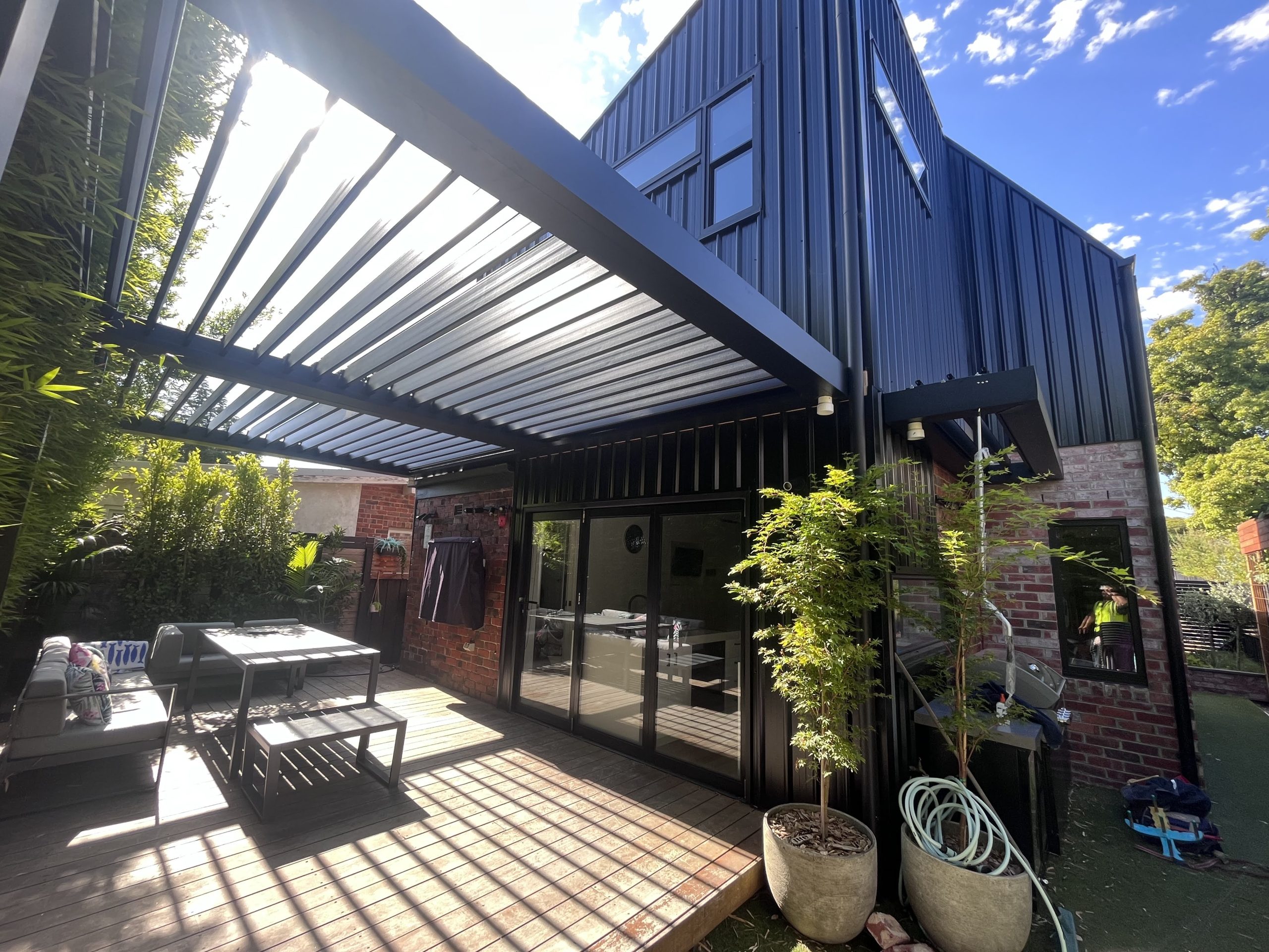 Multi-Bay Extended Attached Pergola for Large Outdoor BBQ & Leisure Space